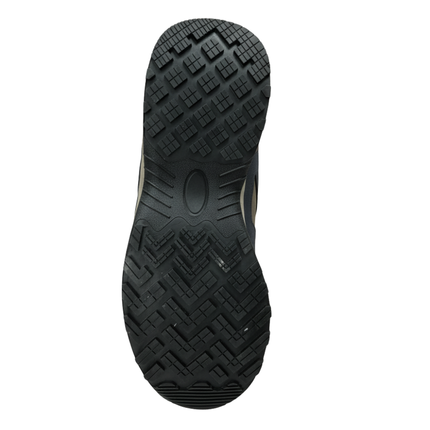 Bottom view of safety shoe rubber outsole showing deep anti-slip tread pattern for traction and stability on various surfaces