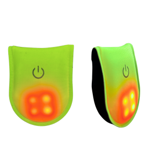 Front and side view of clip-on LED safety light with Lycra fabric shell and red LED, powered by CR2032 coin battery