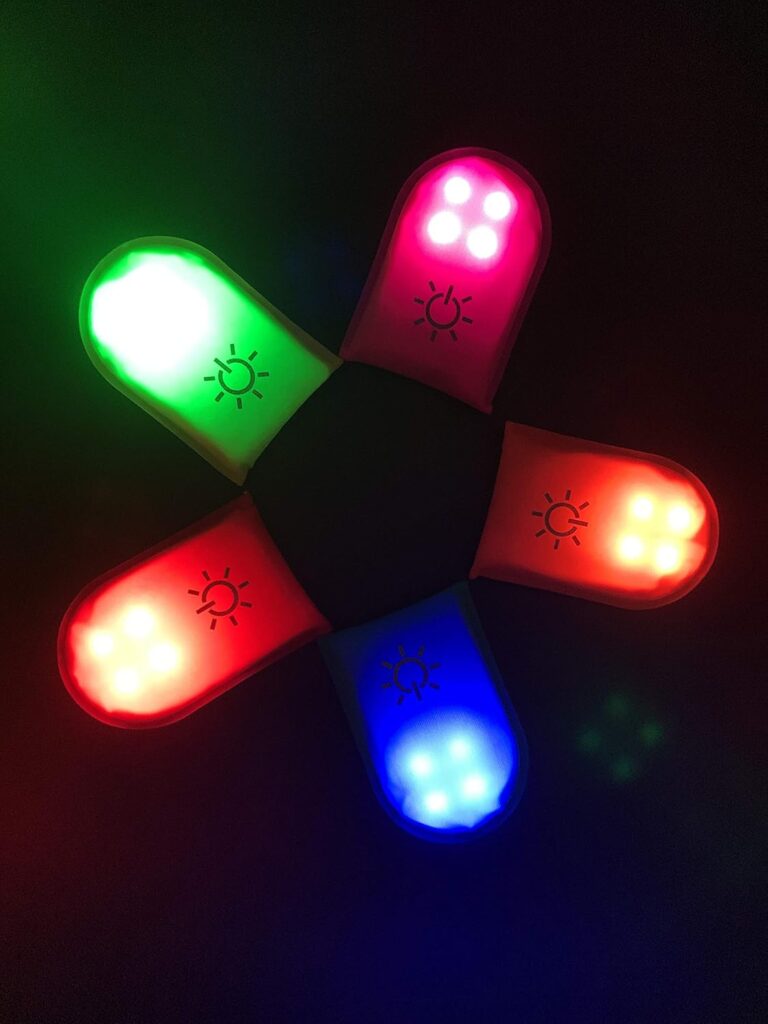 Clip-on LED safety lights showing multiple color modes including red, green, blue, and pink for enhanced night visibility and outdoor safety